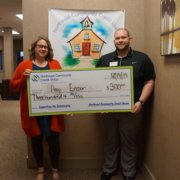 Ben Smith presents the Helping Teachers Teach to Amy Ensor.