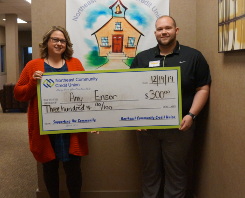 Ben Smith presents the Helping Teachers Teach to Amy Ensor.